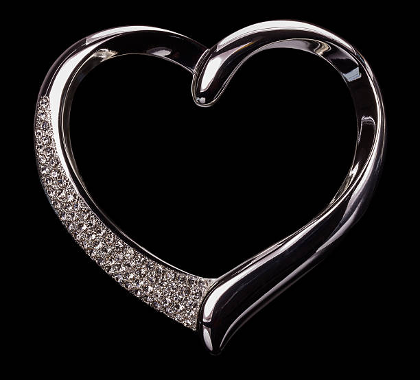 istock silver hearts on the black background 519536125
