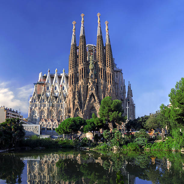 BARCELONA, SPAIN - OCTOBER 8: The Sagrada Familia cathedral BARCELONA, SPAIN - OCTOBER 8: La Sagrada Familia - cathedral designed by Antonio Gaudi, view from the oldest facade at the morning, October 8, 2014 in Barcelona, Spain. high temple stock pictures, royalty-free photos & images