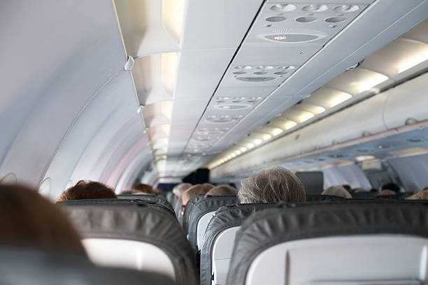 istock Interior inside of the plane with passengers. 519536523