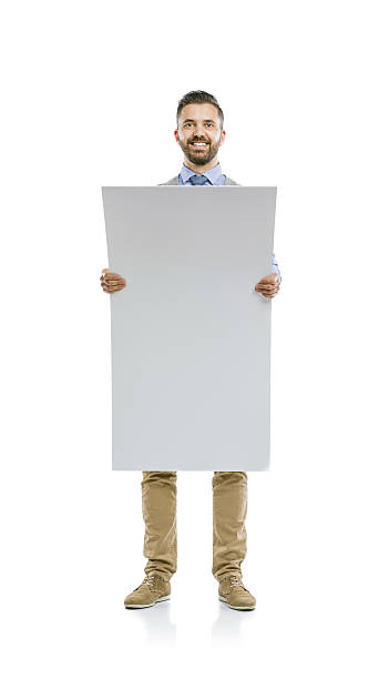 istock Hipster businessman with blank advertisement 519543493