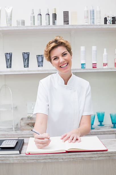 istock Pretty beautician smiling at camera 519543901