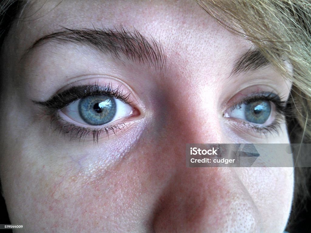 Young womans eyes very close up of young woman's blue eyes Adult Stock Photo