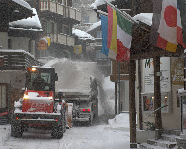 istock Snow removal in small alpine village 519545096