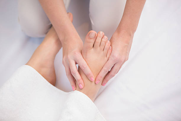 istock Woman receiving a foot massage 519545227