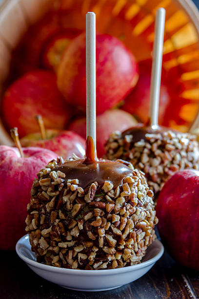 istock Hand Dipped Caramel Apples with Nuts and Chocolate 519545293