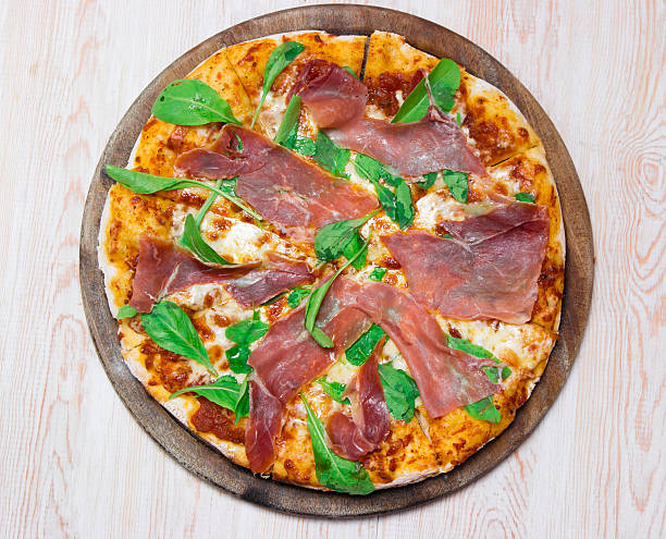 istock Delicious italian pizza on wooden table 519546001