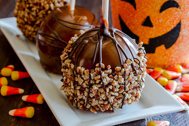 Hand Dipped Caramel Apples with Nuts and Chocolate stock photo