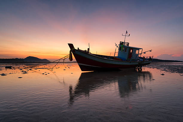 istock Fishing Boat Sitting on Beach in Sand Phuket Thailand 519546337