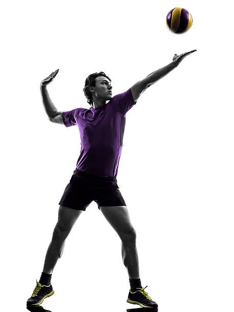 istock volley ball player man silhouette white background 519546391