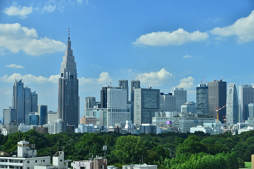 Tokyo skyline of Shinjuku area, one of sub-centers of Tokyo, under blue sky.