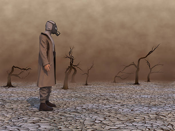 istock Man with gas mask in a wasteland 519549832
