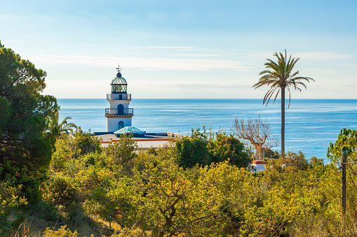 The famous lighthouse near Calella, Costa Brava, Spain, overlooking the blue Mediterranean Sea.