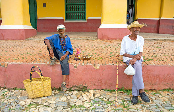 Trinidad, Cuba - 4 DECEMBER 2015 - santerian followers of Saint Lazarus Babalu-Aye sitting by the cathedral on the 4th of december 2015 in Trinidad, Cuba