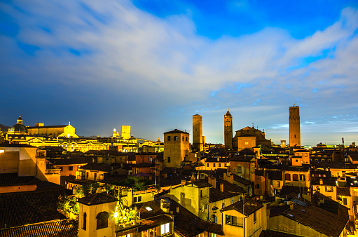 Bologna roofs at evening with churchs and homes