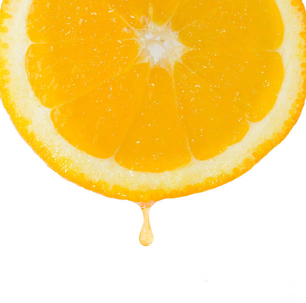 istock Drop of juice falling from orange 519552458