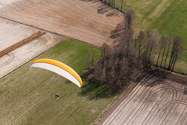 istock aerial view of paramotor flying over the fields i 519553738