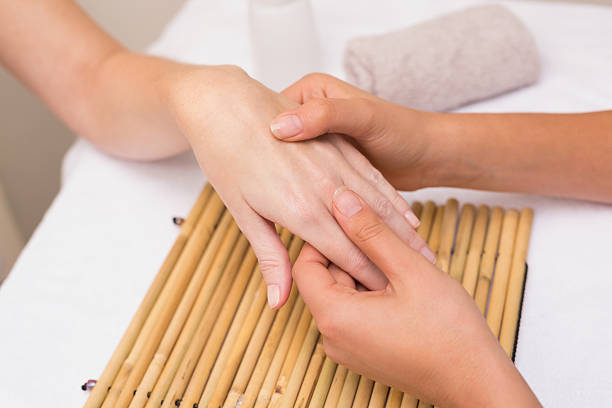 istock Woman getting a hand massage 519556249