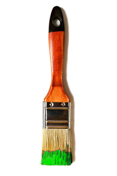 istock Paintbrush with green paint (isolated on white) 519556286