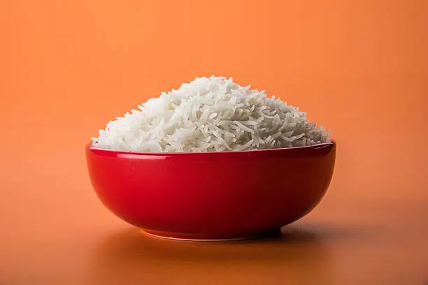 Photo of plain cooked white basmati or basamati rice in ceramic bowl