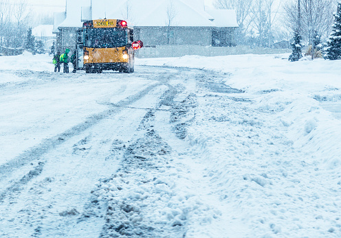 School Students Boarding Blizzard Snow Storm School Bus