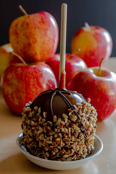 istock Hand Dipped Caramel Apples with Nuts and Chocolate 519556927