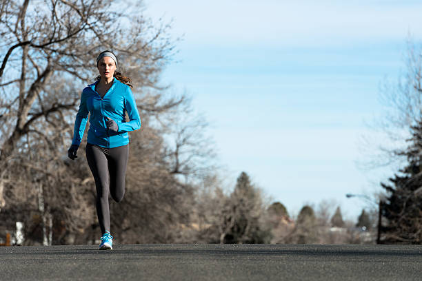 istock Woman Running in Winter 519557113