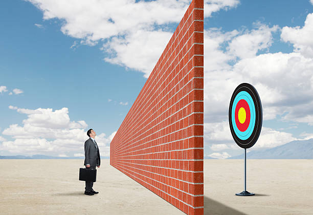 istock Brick Wall Preventing Businessman From Reaching His Goal 519557352