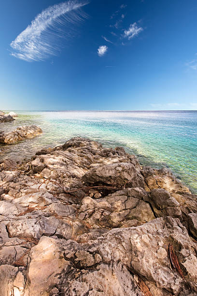 Rocky beach scenery with clear blue sky in Croatia stock photo