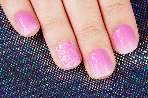 istock Nails with manicure covered with pink nail polish 519558618