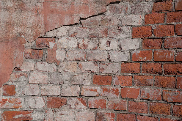 istock Texture of old wall covered with pink stucco 519558815