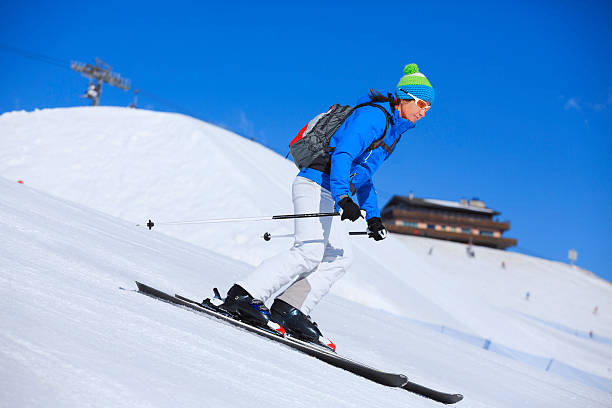 istock Women snow skier - carving skiing 519559395