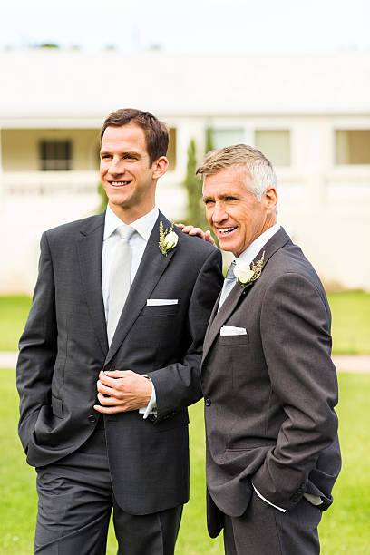 istock Father And Groom Looking Away In Garden 519559483