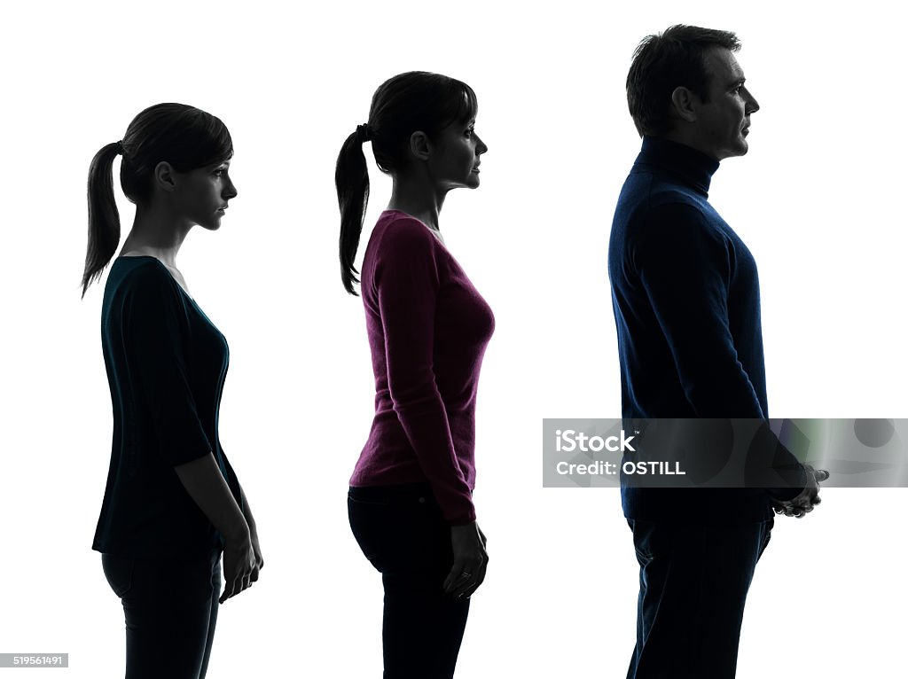 family father mother daughter standing serious profile portrait one  family father mother daughter man standing serious profile portrait in silhouette studio isolated on white background Portrait Stock Photo