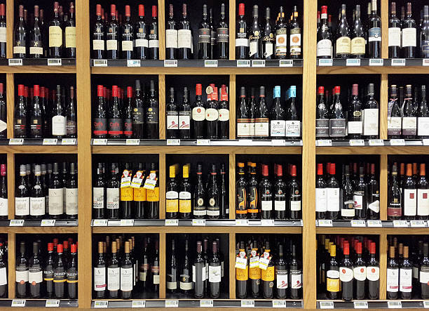 South African wines stacked on shelves in liquor store A variety of South African wines stacked on the shelves of a liquor store. alcohol shop stock pictures, royalty-free photos & images