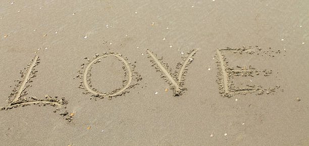 istock love the inscription on the sand 519571613