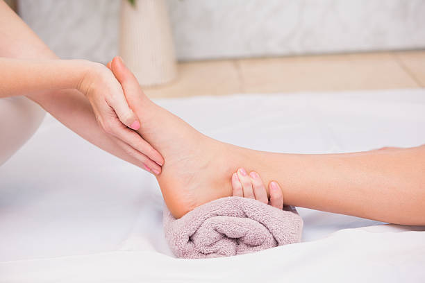 istock Woman receiving a foot massage 519571731