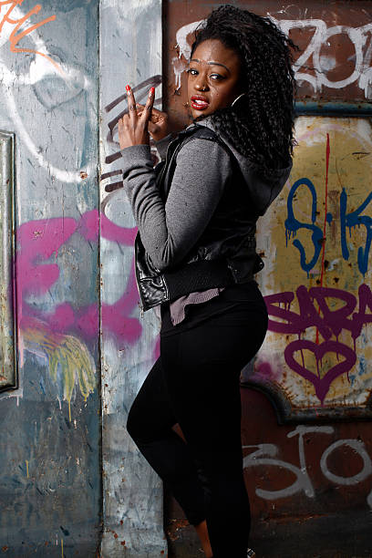 istock Young Black Woman in Peace Sign Gesture 519574099