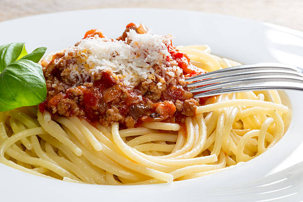 istock Spaghetti with Bolognese Sauce Parmesan and basil 519574773