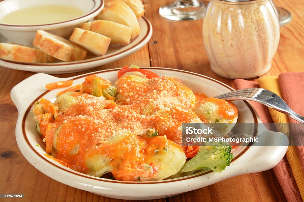 Asiago Ravioli Spring Four cheese ravioli with creamy tomato vodka sauce and garlic bread Asiago - Cheese Stock Photo