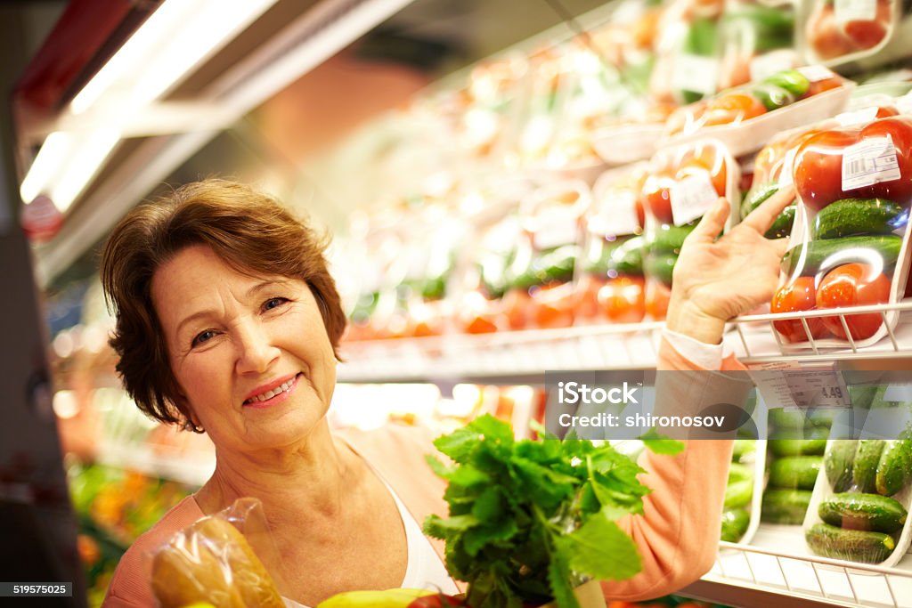 Female customer Image of senior woman in groceries department Active Seniors Stock Photo