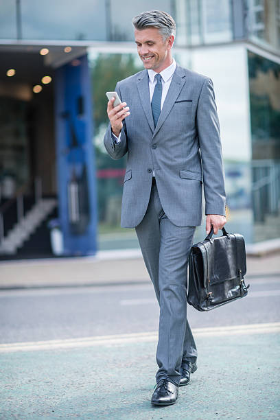 istock Business man holding mobile phone 519575199