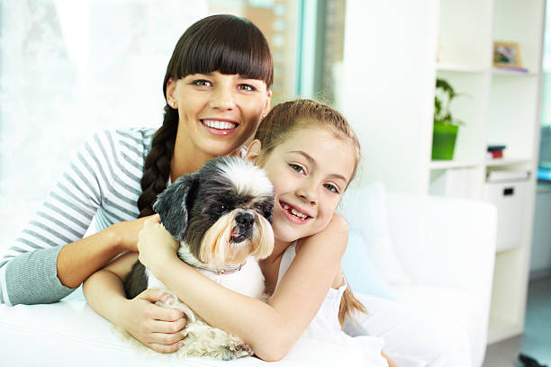 istock Mother, daughter and pet 519575201