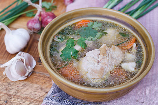 istock Chicken soup on wooden background,selection focus. 519575282