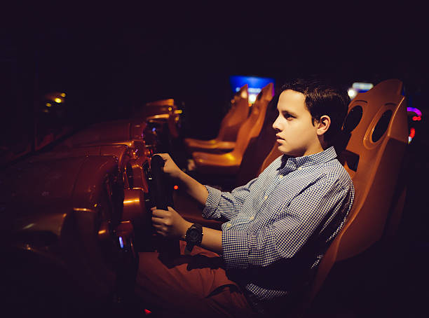 istock teen driving arcade game 519575971