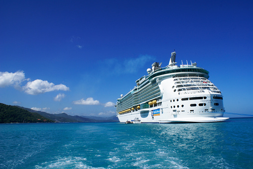 Labadee, Haiti - October 12, 2009:  Royal Caribbean Cruises, cruise ship Freedom of the seas anchored in Labadee. Labadee is a port located on the northern coast of Haiti. It is a private resort leased to Royal Caribbean Cruises.
