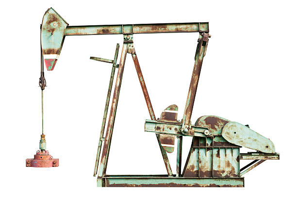 istock Old Oil pump jack isolated on white background 519577541