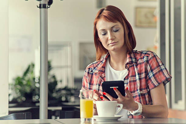 istock Woman with Laptop in cafe 519577739