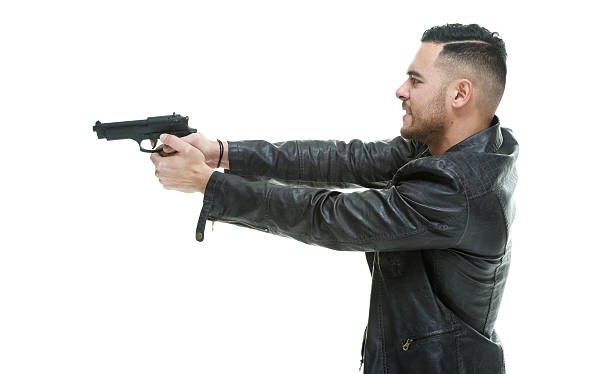 istock Casual angry man aiming with handgun 519578006
