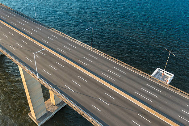 istock Aerial view of empty highway bridge over the ocean 519578578