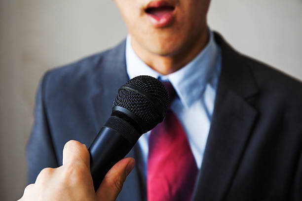 istock Young man feeling awkward getting asked by a journalist 519579704